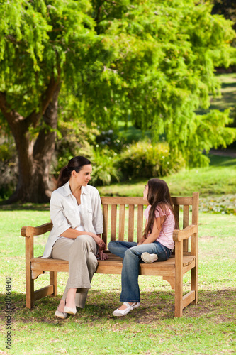 Mother and her daughter on the bench