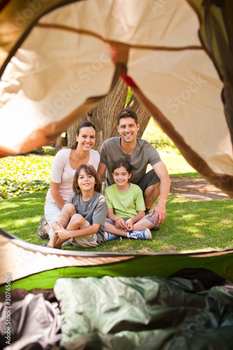 Joyful family camping in the park photo