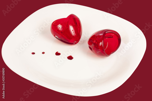 Two hearts of glass on a plate