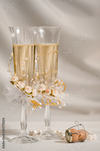 Two wedding glasses with champagne