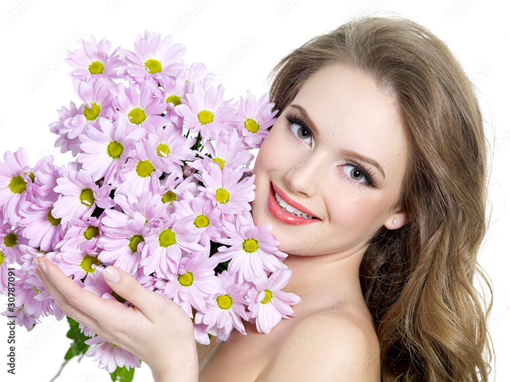 Happy woman with spring purple flowers Happy woman with spring purple flowers
