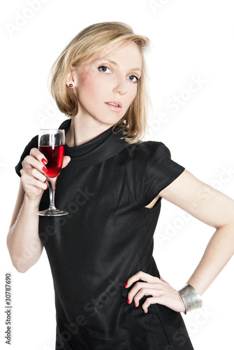 Young attractive woman holding a glass of red wine