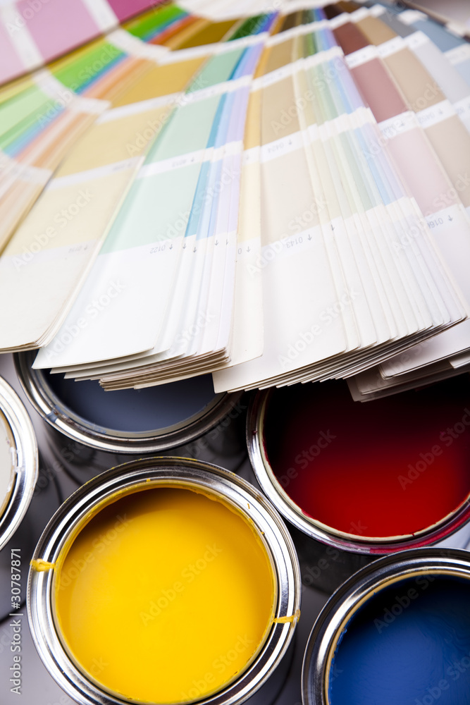 Cans and paint on the colourful background Cans and paint on the colourful background