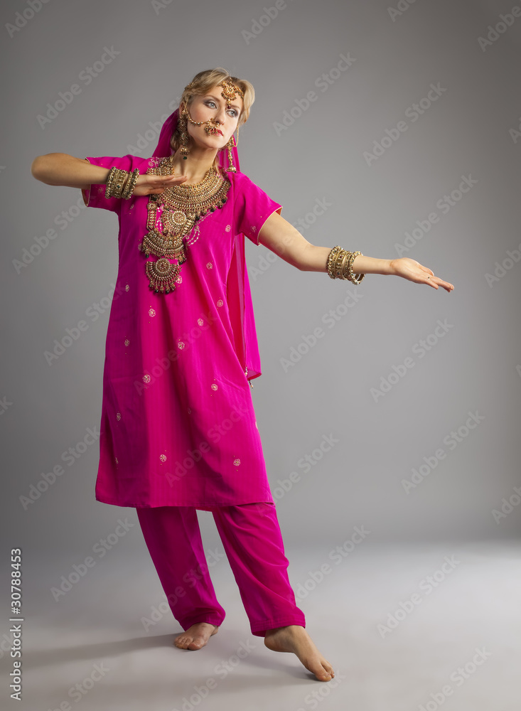Dancer stand in rose oriental indian costume Dancer stand in rose oriental indian costume