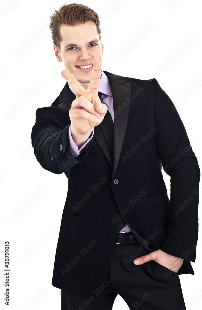 Cheerful young businessman showing victory hand sign, isolated Cheerful young businessman showing victory hand sign, isolated