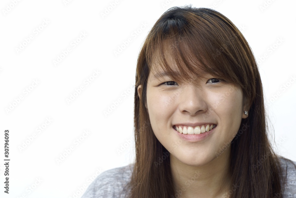 Asian chinese lady smiling with white background Asian chinese lady smiling with white background
