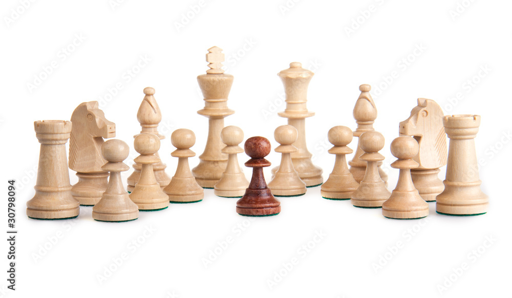 A little black pawn facing the white enemy A little black pawn facing the white enemy