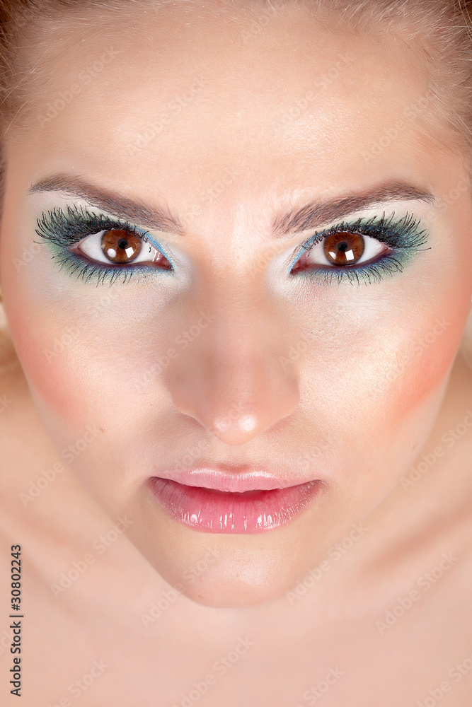 Portrait of the beautiful woman with make-up on white background Portrait of the beautiful woman with make-up on white background