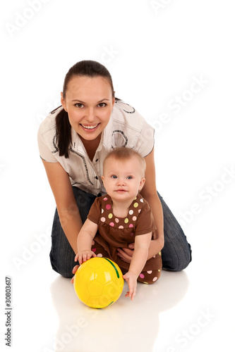 laughing baby playing with mother
