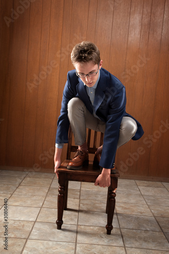 Man Stands On Chair