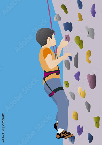 Boy climbing artificial rock