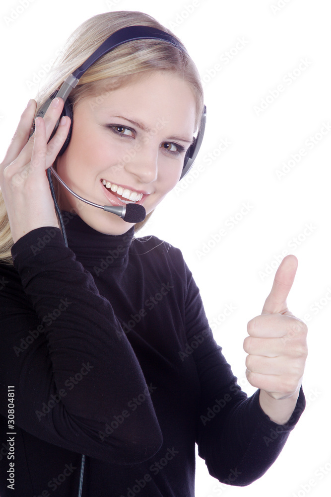 Blonde Frau mit Headset hält lachend Daumen hoch Porträt Blonde Frau mit Headset hält lachend Daumen hoch Porträt