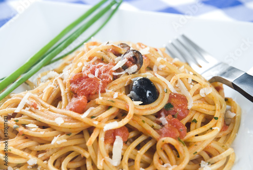 Spaghetti Puttanesca,a traditional italian recipe.