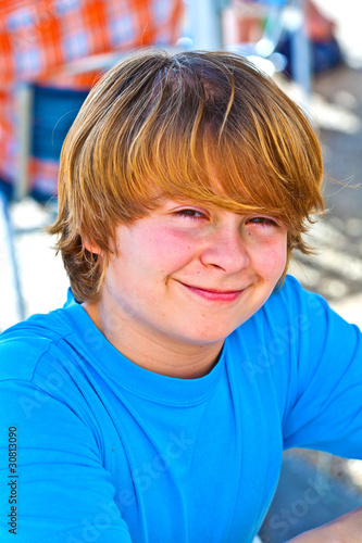 outdoor portrait of relaxed cute young boy