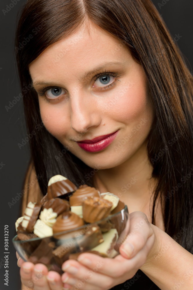 Chocolate - portrait young woman hold candy Chocolate - portrait young woman hold candy