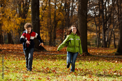 Kids running in autumn park