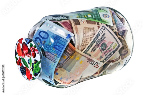 glass jar or bank full of different nominal money isolated over