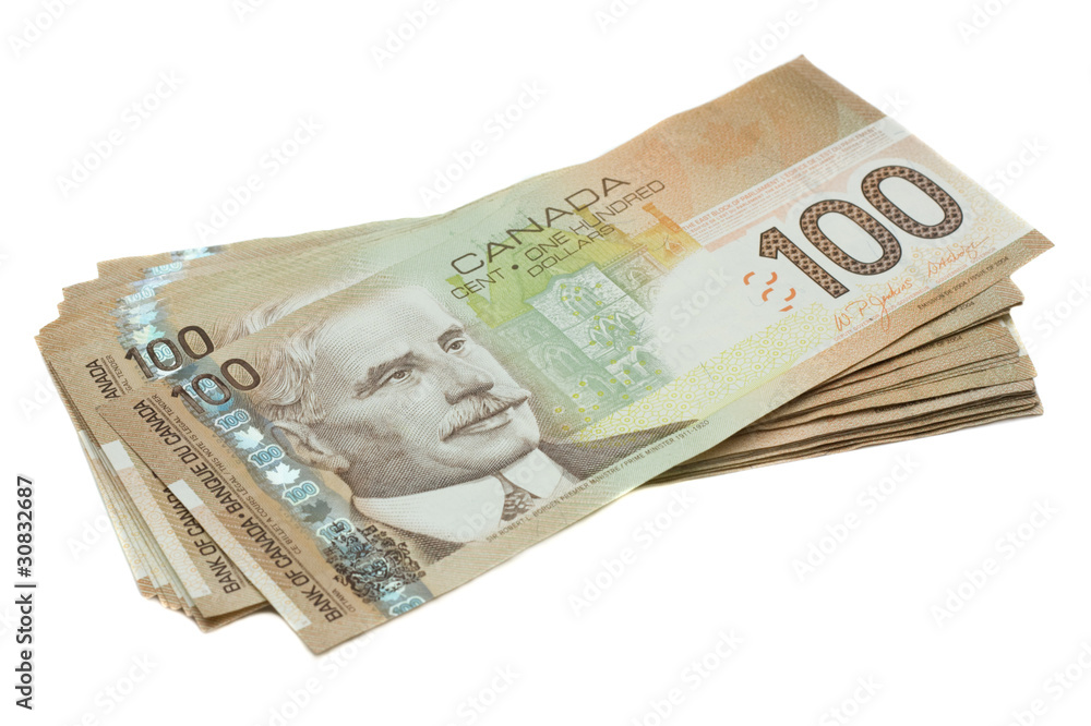 A stack of Canadian one hundred dollar bills A stack of Canadian one hundred dollar bills