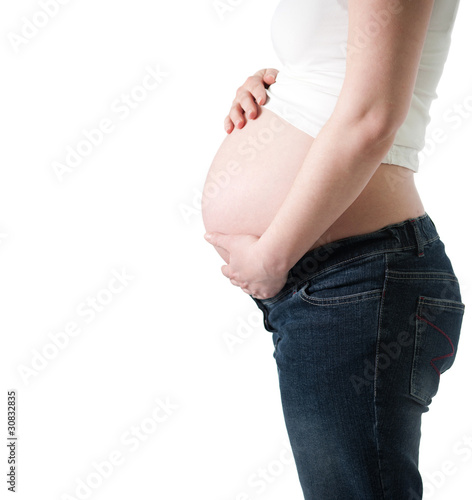 hands of the pregnant woman holding her belly