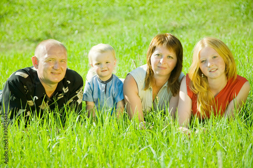 family  lying on grass © JackF