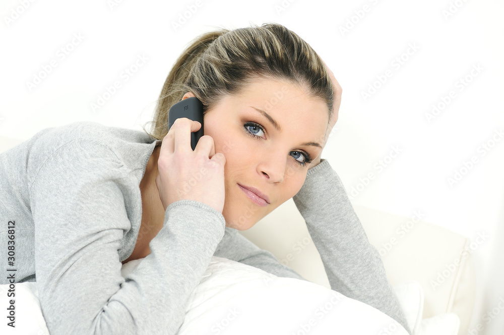 young beautiful woman on telephone in his sofa young beautiful woman on telephone in his sofa