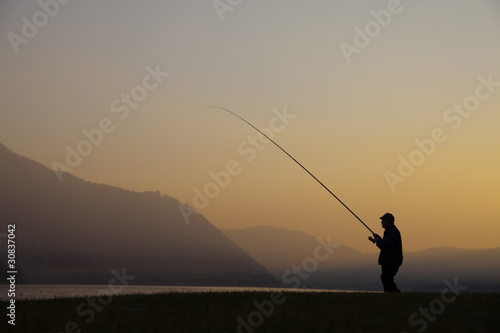 Fisherman on the lake of Como © bubblegun