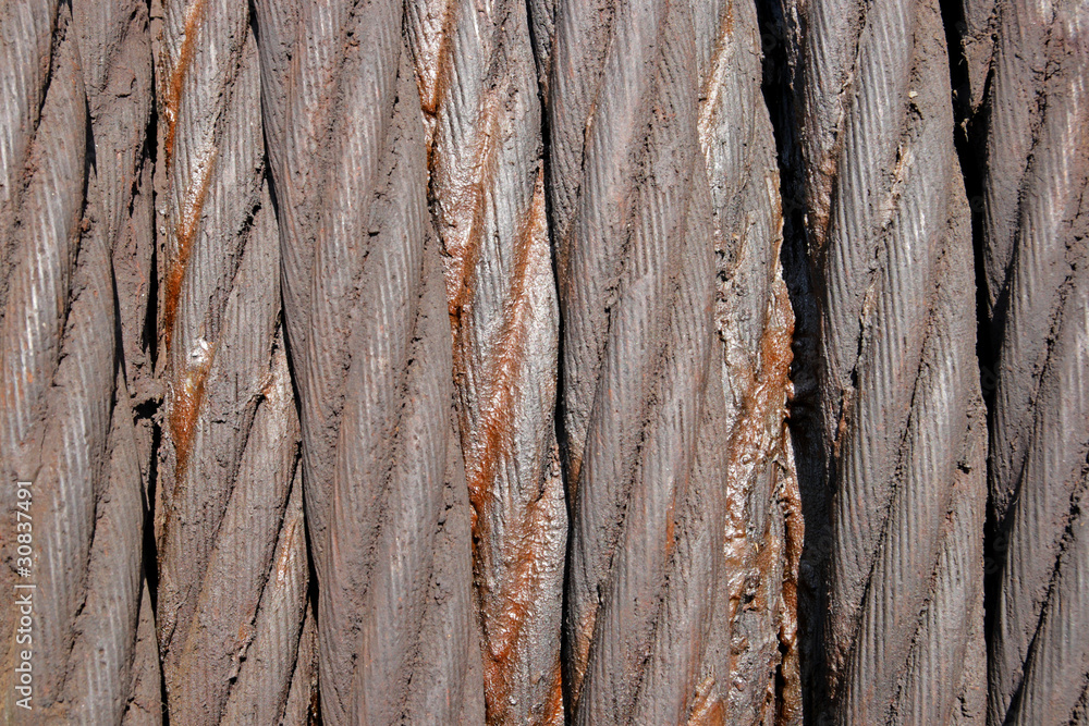 Background from a thick old steel rope in greasing Background from a thick old steel rope in greasing