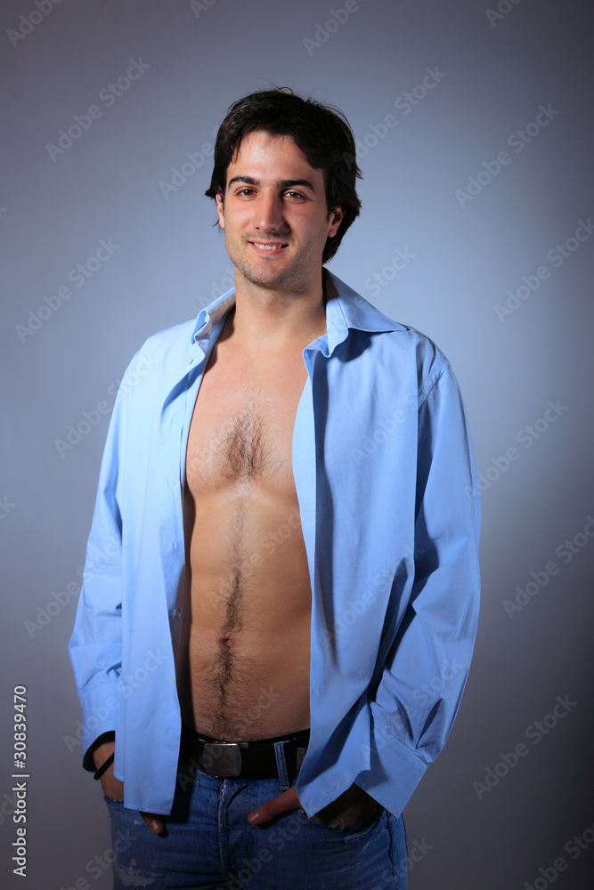 young man with unbuttoned shirt young man with unbuttoned shirt