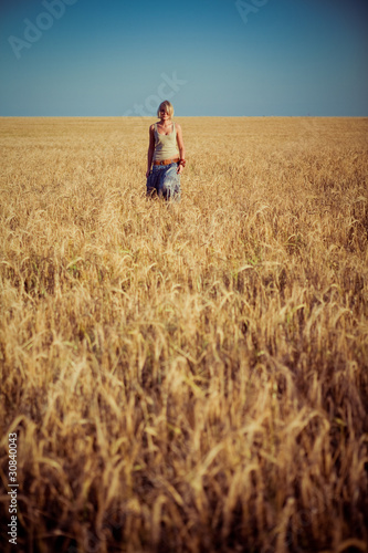 Image of young woman on wheat field © Nastya Tepikina