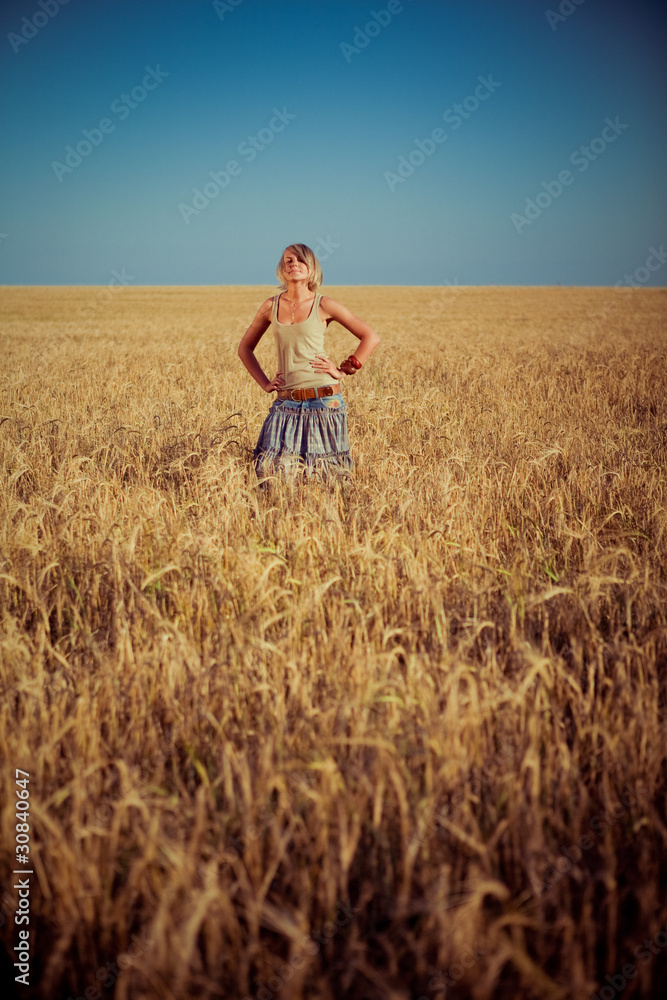 Image of young woman on wheat field Image of young woman on wheat field