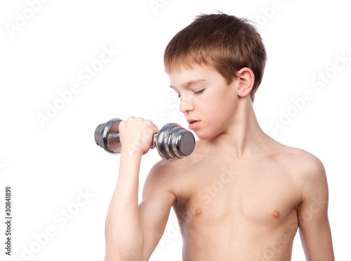 Tennager holds dumbbell photo