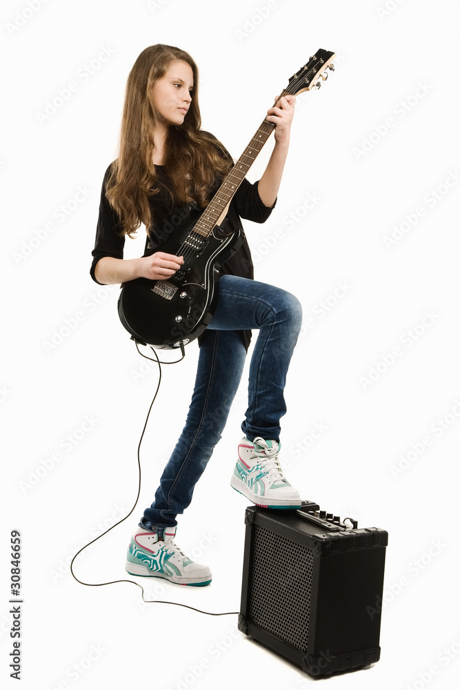 Fototapeta premium Happy teenager girl playing guitar