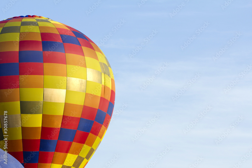 Naklejka premium colorful hot air balloon in blue sky