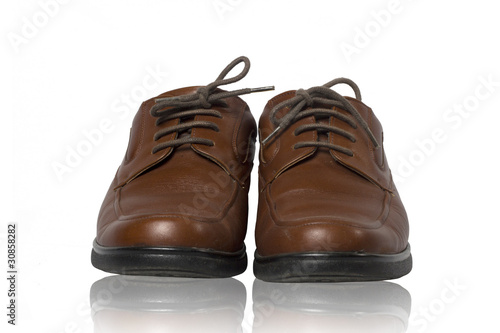 Pair of brown male classic shoes isolated on white background © photofriday