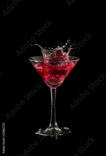 red martini cocktail splashing