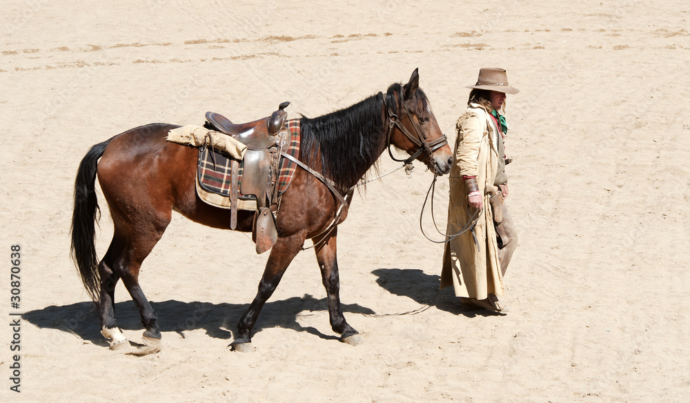 Cowboy Bandit walking his horse, Mini Hollywood, Spain Cowboy Bandit walking his horse, Mini Hollywood, Spain
