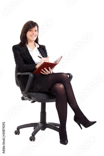 Young businesswoman accounting and sitting on a chair