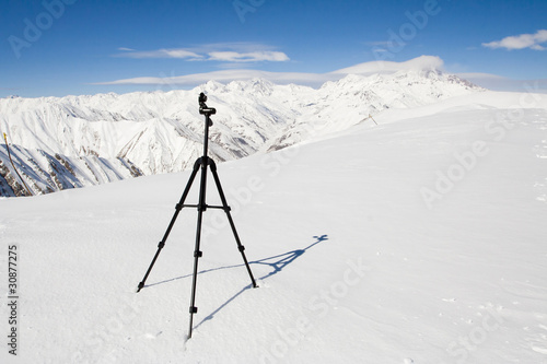 Tripod surrounded with mountains