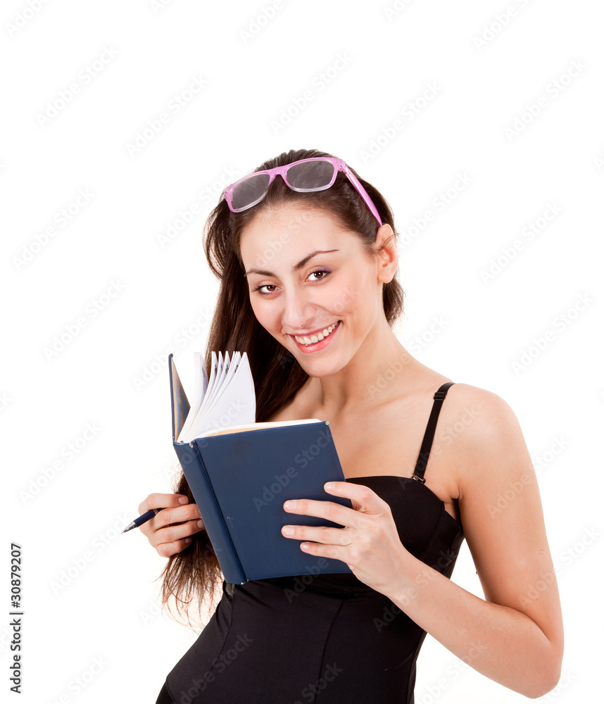 Pretty young girl with book, pen and glasses isolated on white Pretty young girl with book, pen and glasses isolated on white