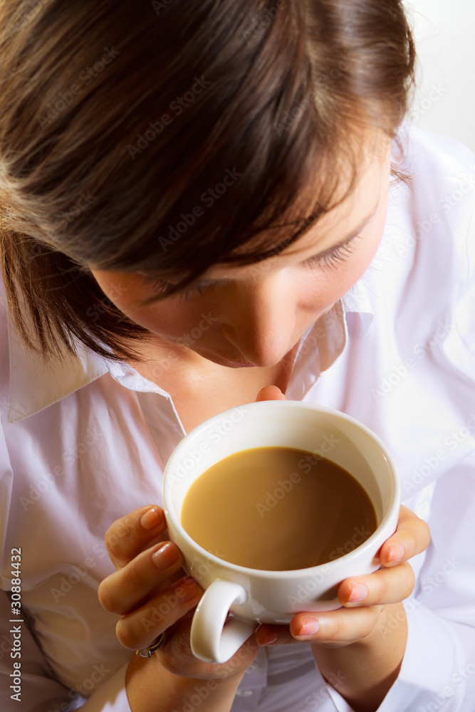 woman with cup of coffee with wilk