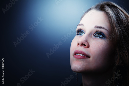 Hopeful young woman glancing into her future