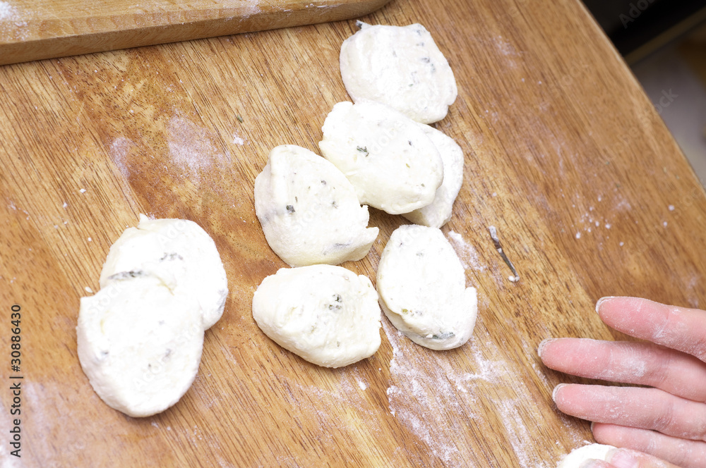 hands in flour closeup kneading dough on table hands in flour closeup kneading dough on table
