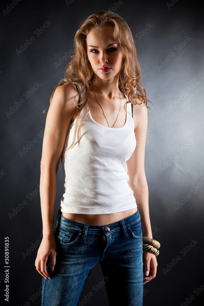 Sexy girl in white t-shirt and jeans Stock Photo | Adobe Stock