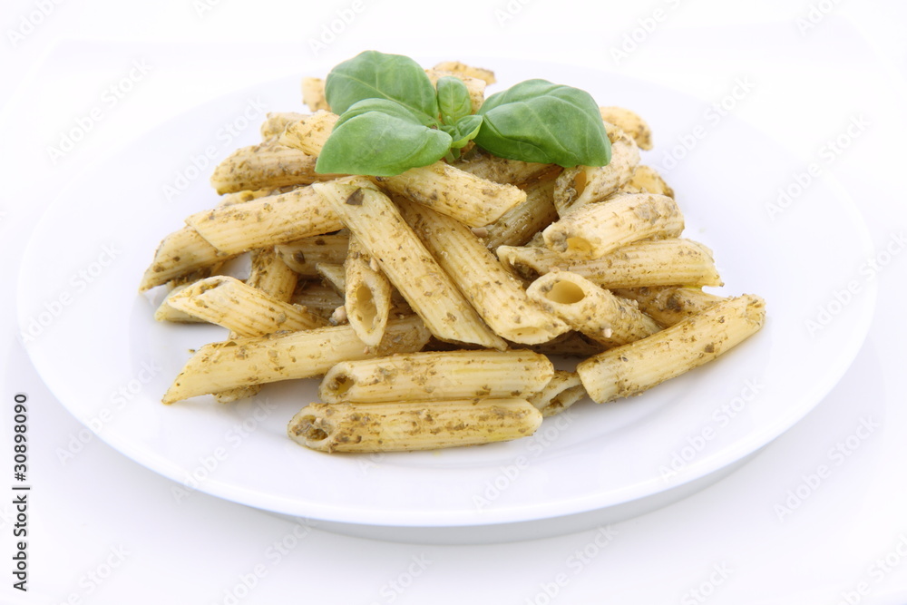 Penne with pesto decorated with basil Penne with pesto decorated with basil