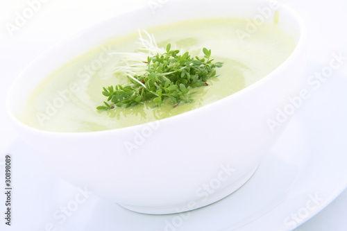 Pea and mozzarella soup decorated with cress