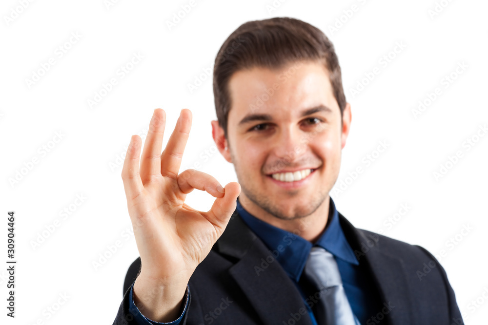 Businessman showing ok gesture isolated on white Businessman showing ok gesture isolated on white