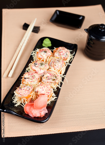 Table place setting with sushi roll