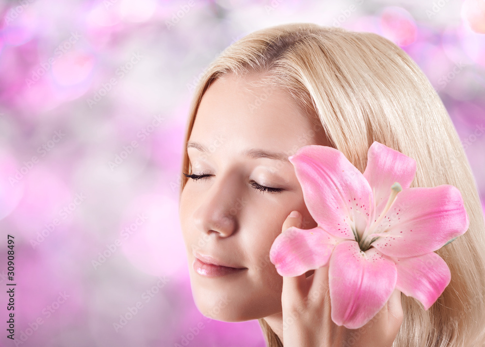 Beautiful young blonde woman with lily flower Beautiful young blonde woman with lily flower