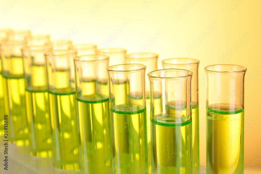 Test-tubes on yellow background Test-tubes on yellow background