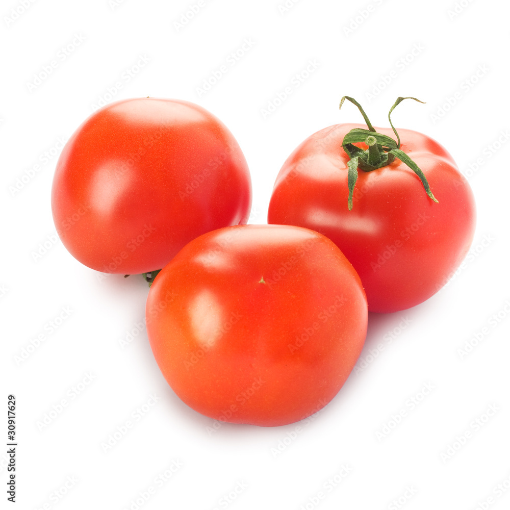 Three tomatoes with a green branch isolated on a white backgroun Three tomatoes with a green branch isolated on a white backgroun